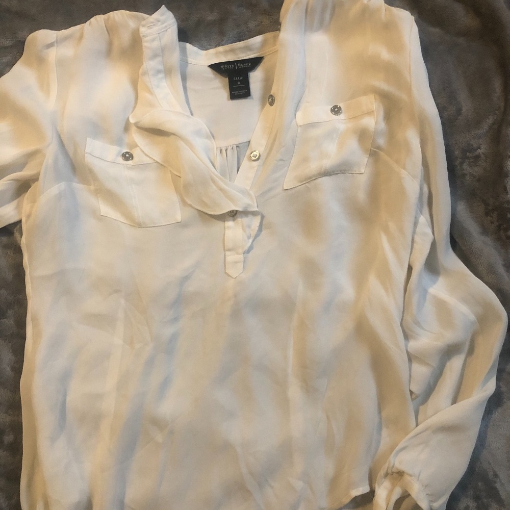 cream colored blouse with ruffles